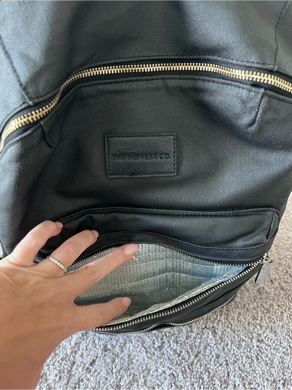 Black diaper backpack by The Honest Company